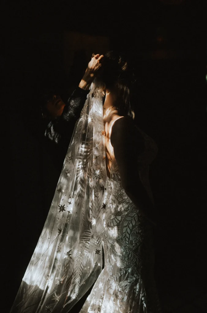 Bride captured in cinematic lighting, creating a dreamy and romantic atmosphere, highlighting her elegance and beauty