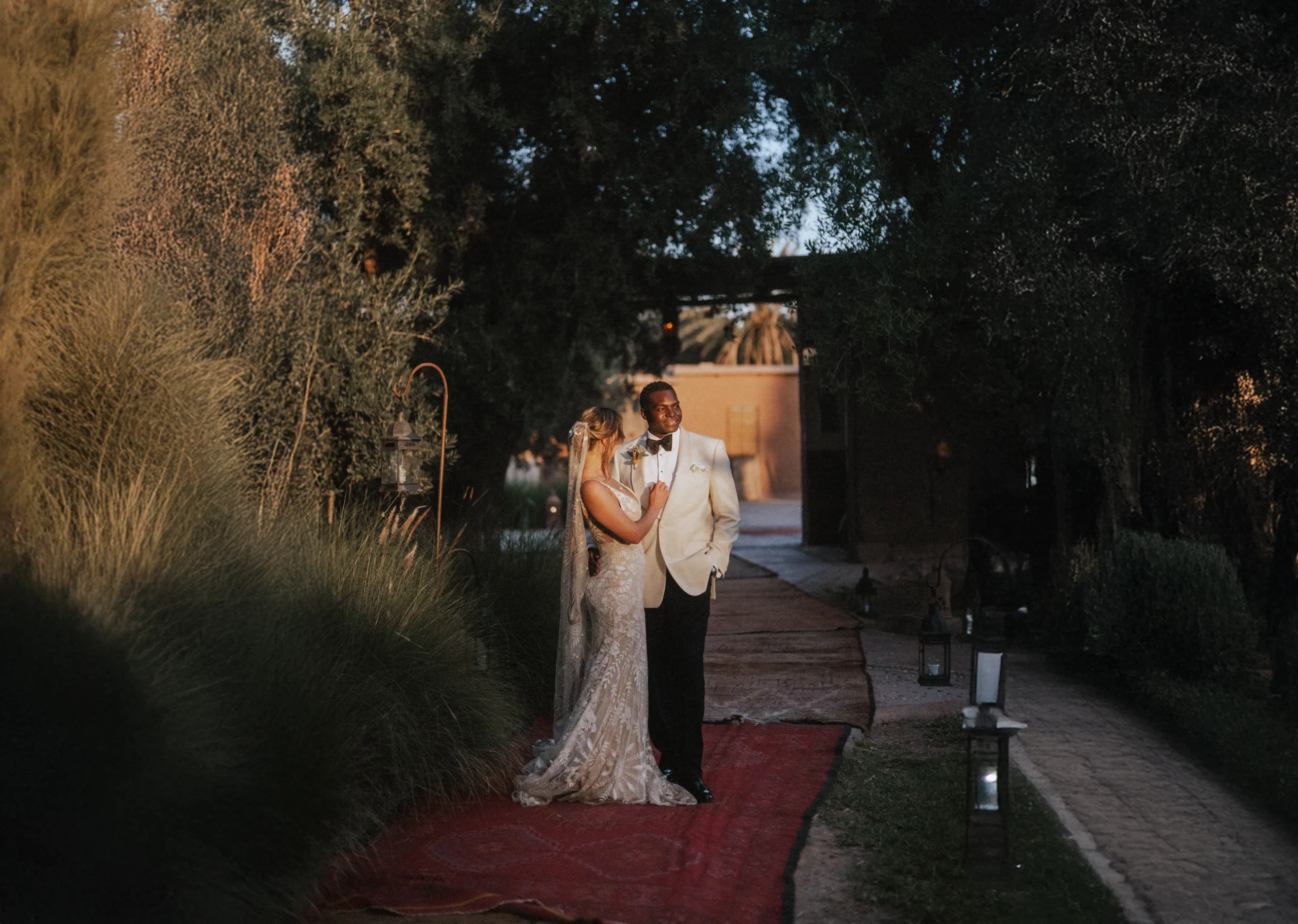 The couple enjoying a romantic moment together, capturing the joy and love of their special day