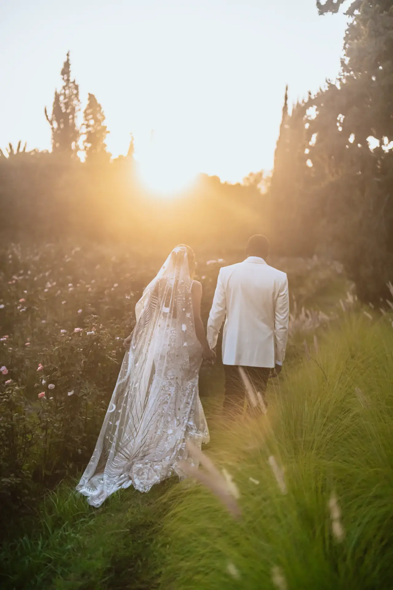 The couple sharing a joyful moment, laughing together, fully immersed in the happiness of their special day.