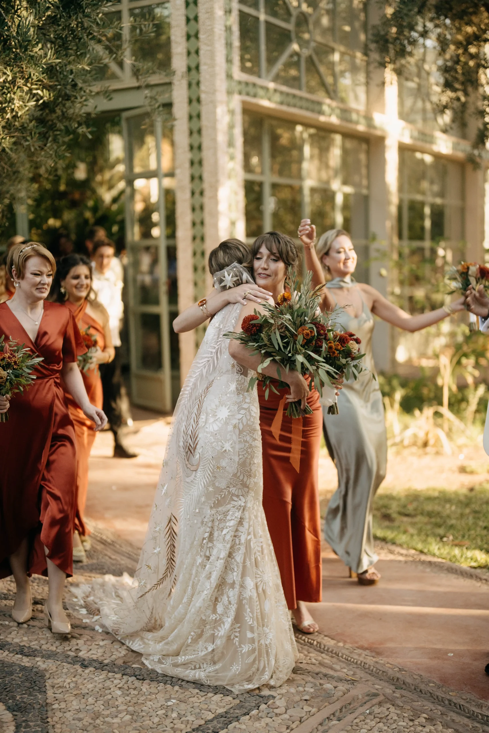Bride and bridesmaids in terracotta and warm earth tones