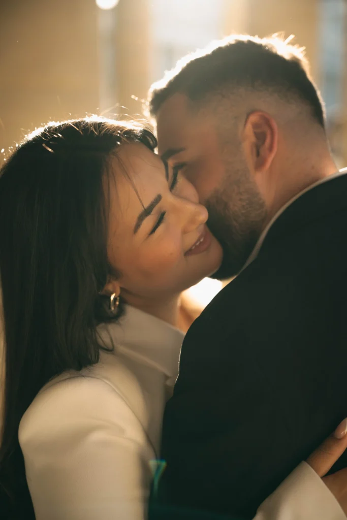 Close-up of a couple sharing an intimate golden hour moment