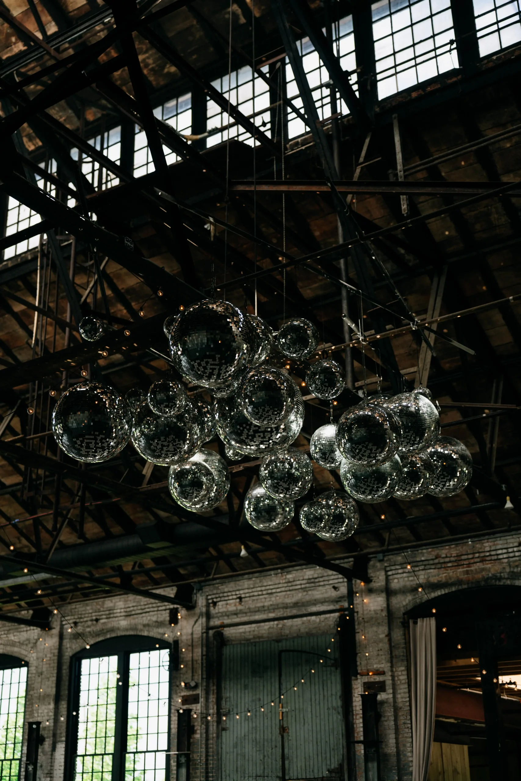 Glass orbs hanging from the ceiling inside Hudson Basilica.