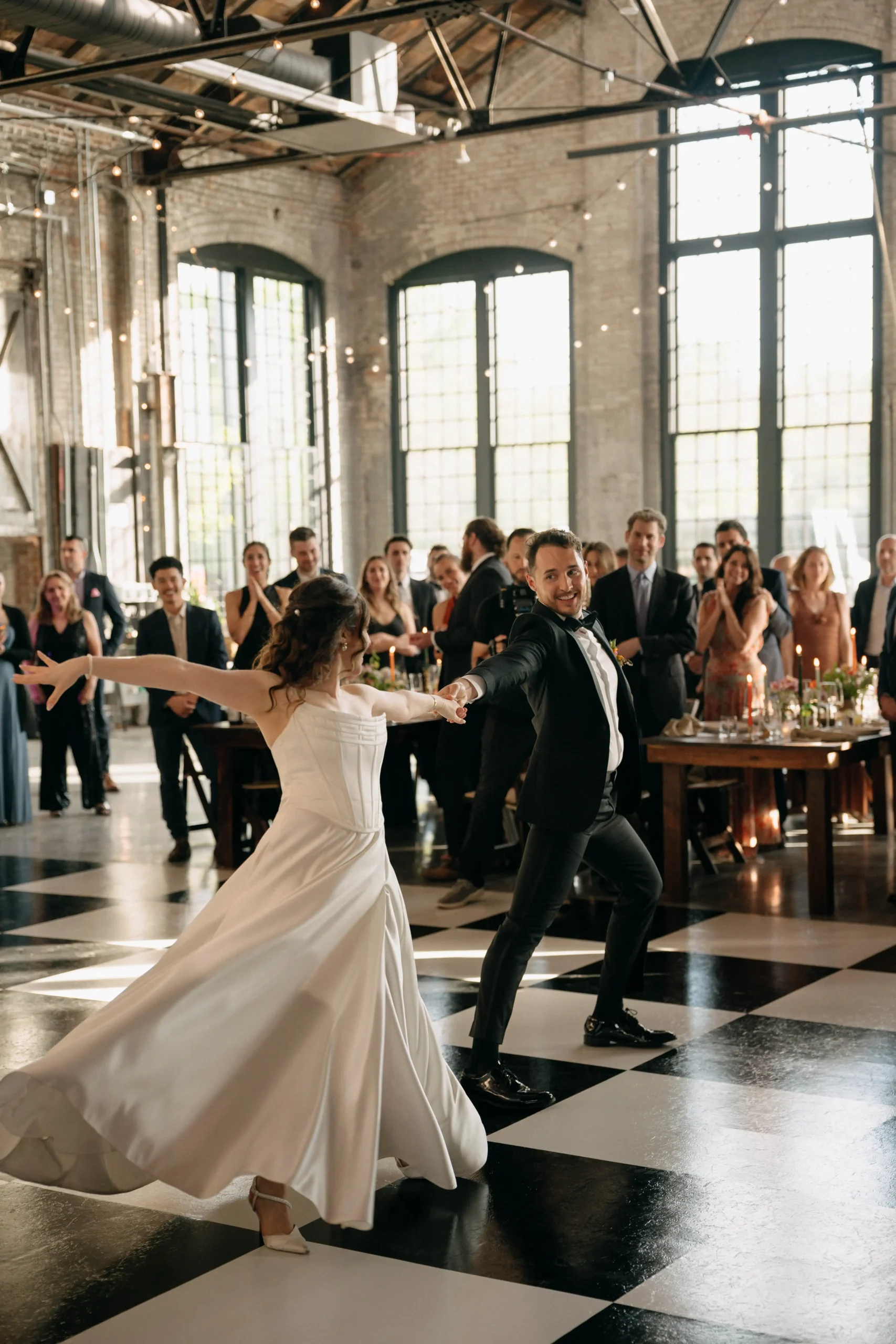 Couple dancing joyfully during the wedding reception at Hudson Basilica.