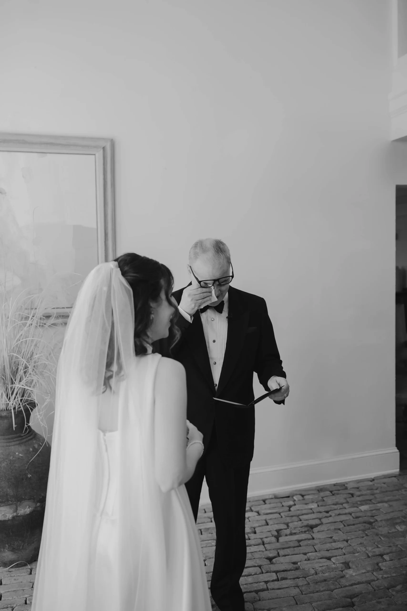 Alex smiling at her father at the first look moment.