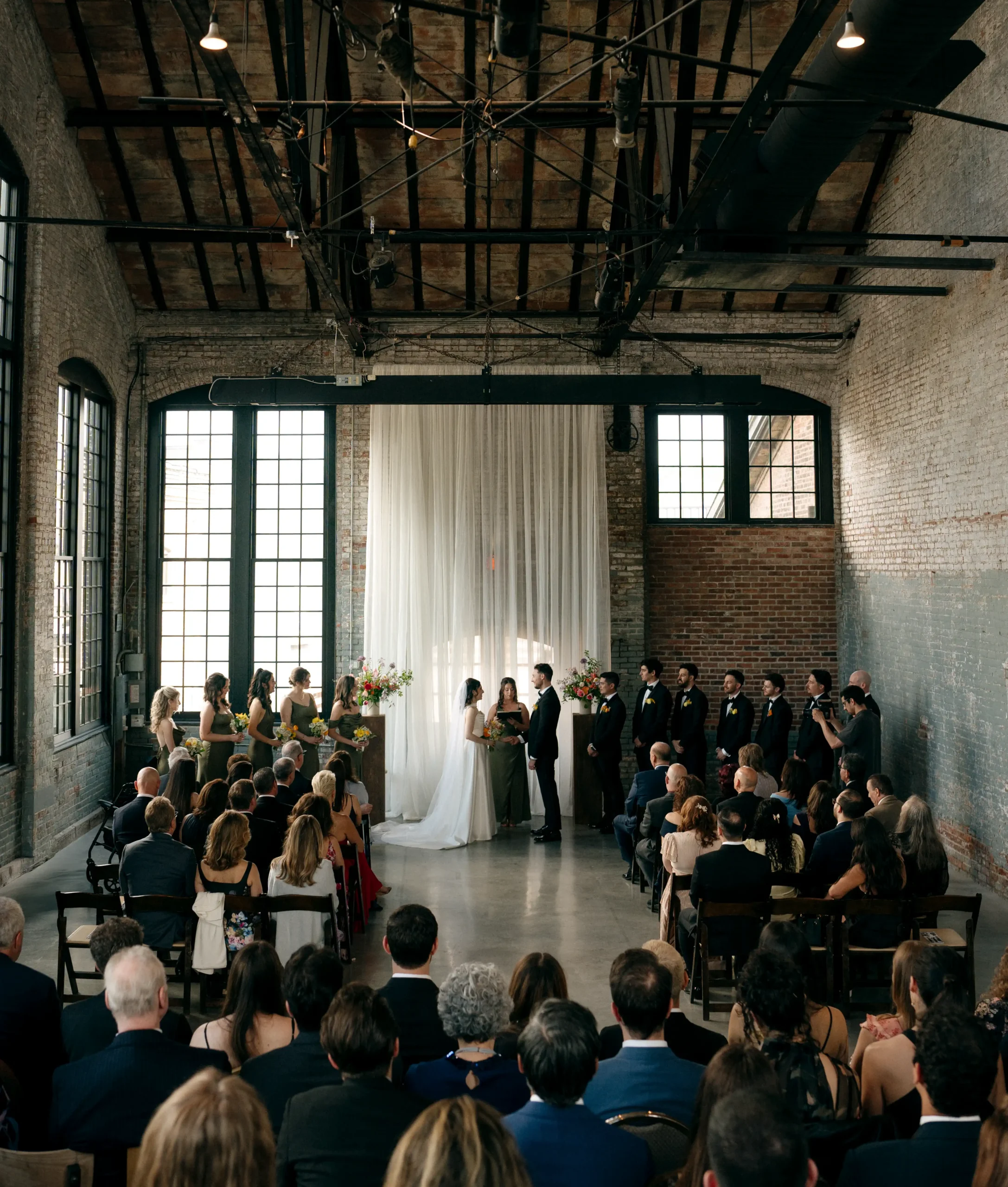 Cinematic indoor wedding ceremony in an industrial loft