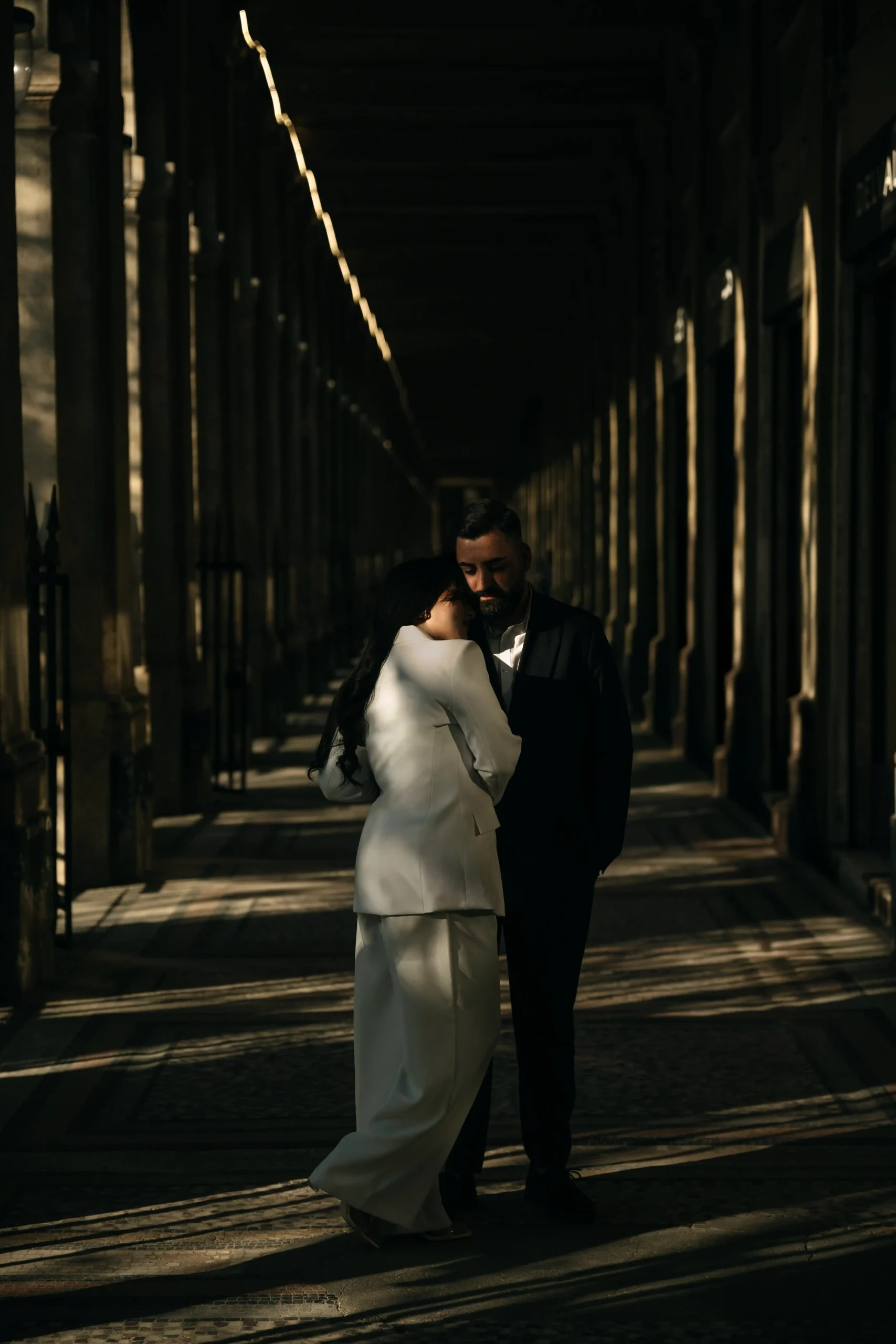 Golden hour light on Parisian rooftops at Rue de Rivoli.