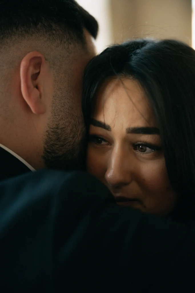 Close-up of the bride's eyes during an emotional embrace.