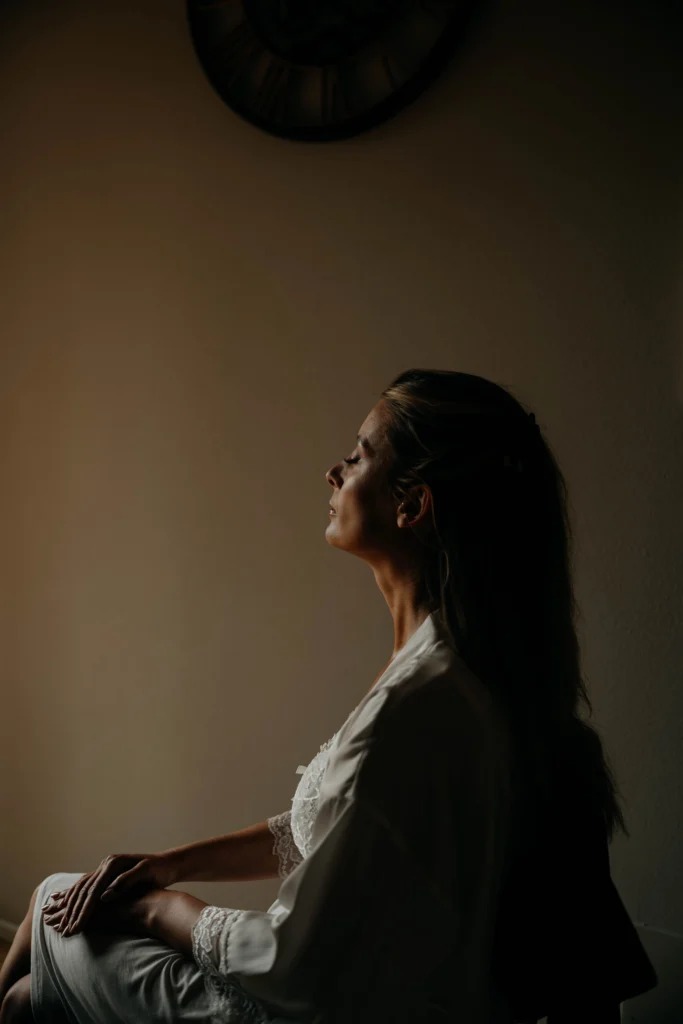Bride in soft morning light before Tuscany wedding – cinematic and calm bridal portrait indoors