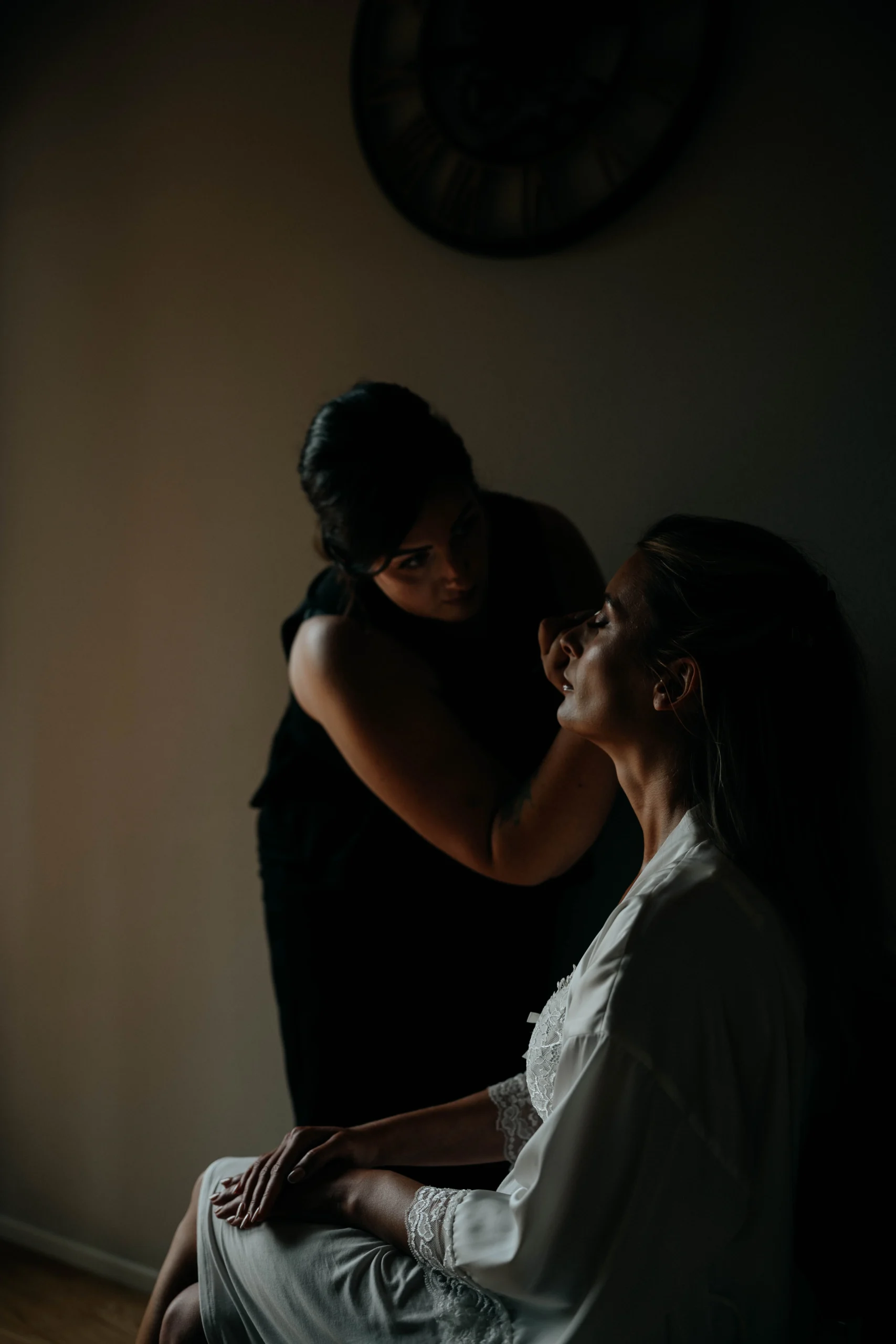 Bride getting makeup done in Tuscany – cinematic shadows and moody natural light