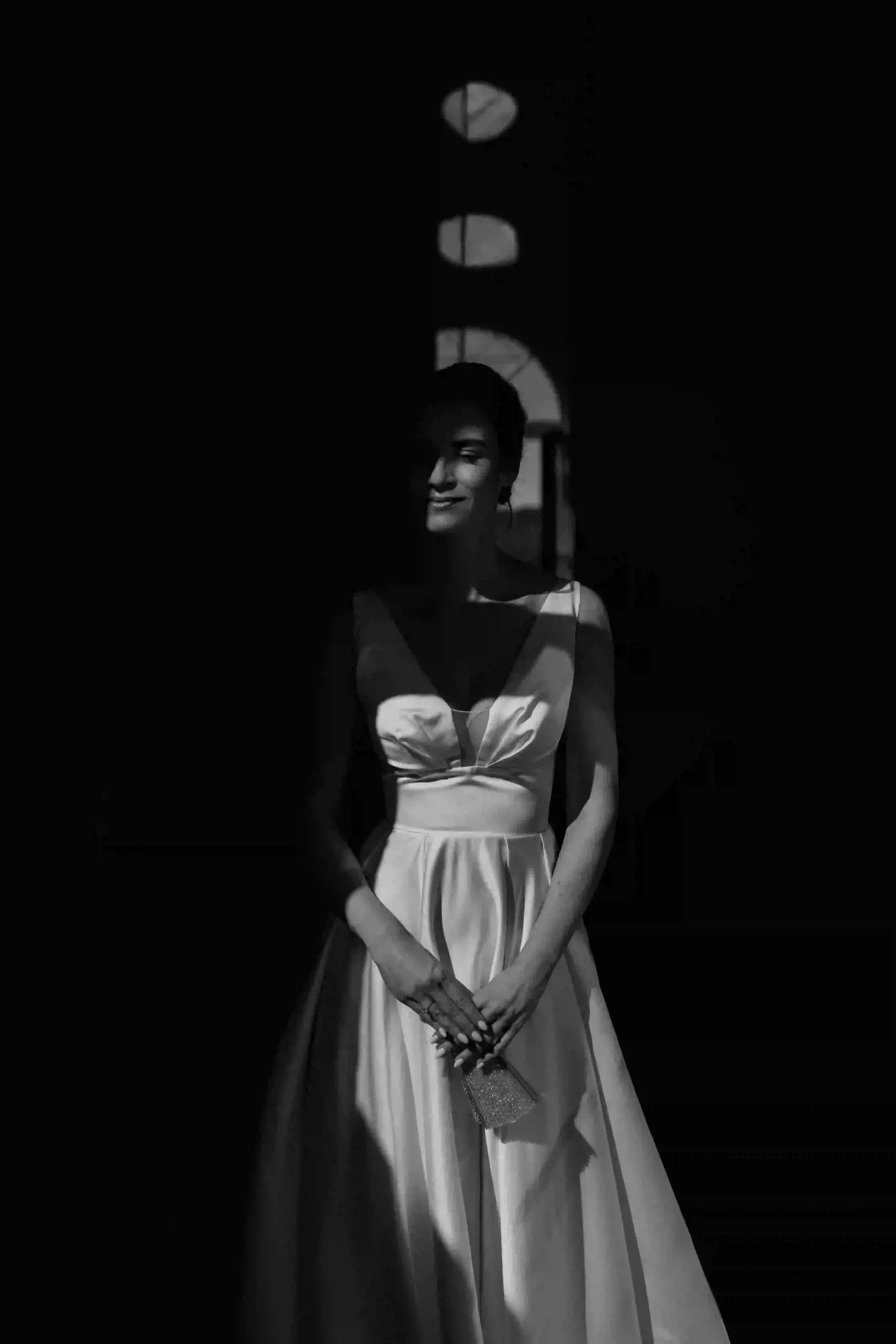 Bride in window light, black and white portrait with light stripes, Munich wedding at La Villa