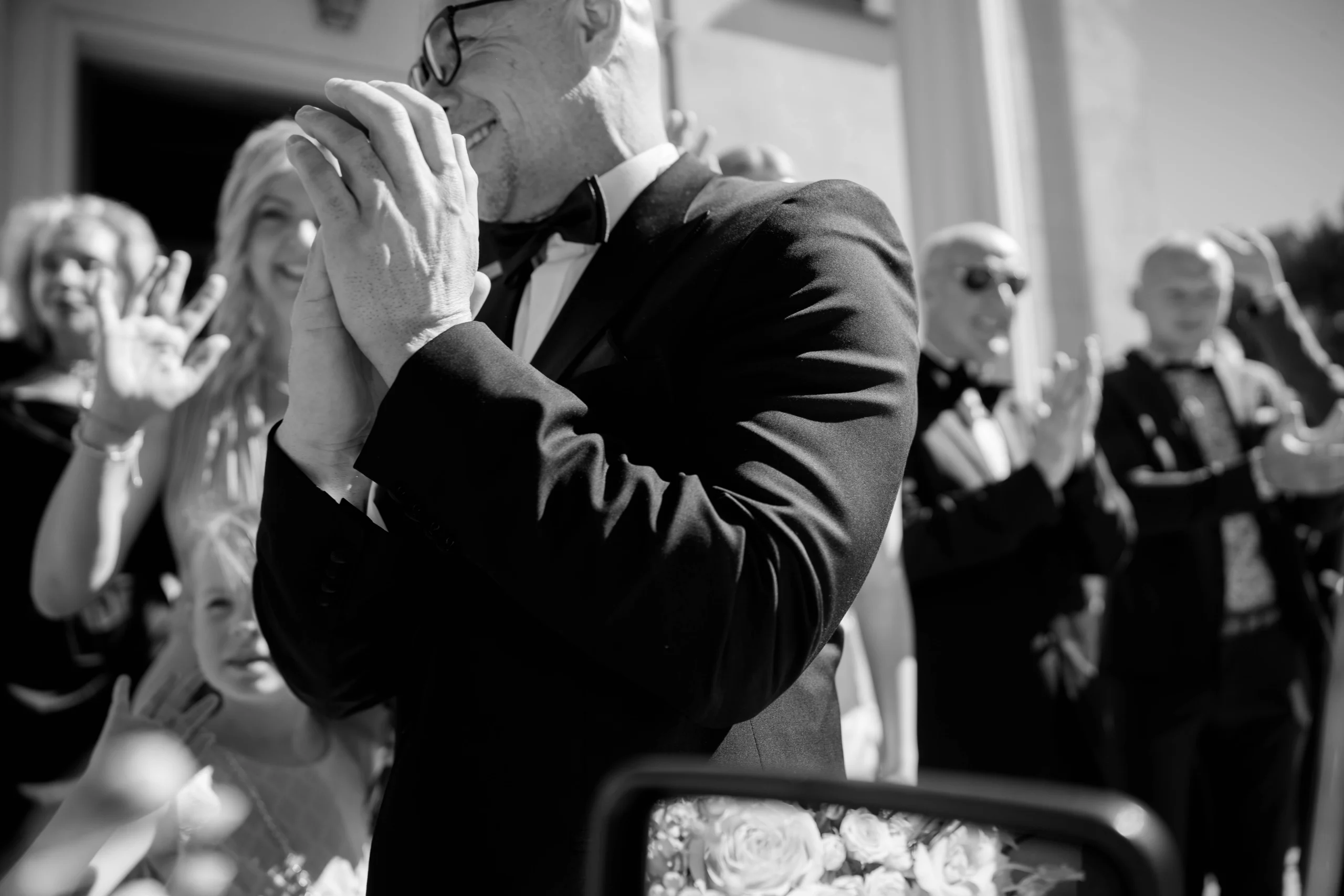 Guest applauding in close up, emotional reaction in black and white, Munich at La Villa
