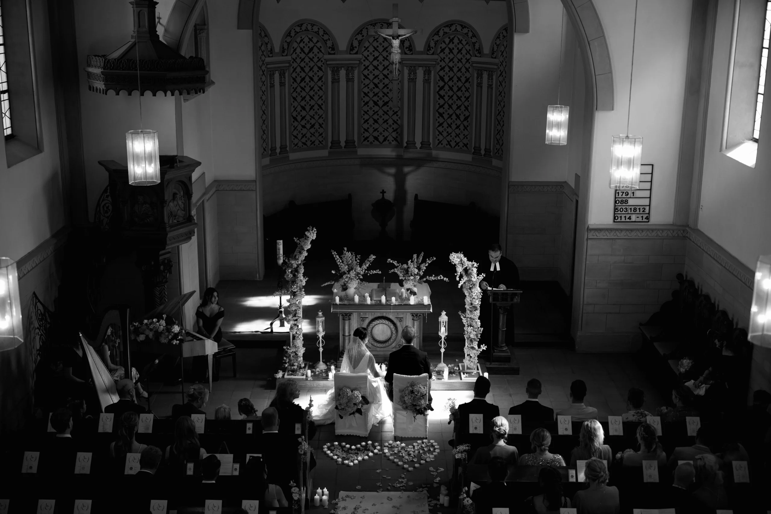 Wide black and white scene of the church ceremony, Munich wedding at La Villa