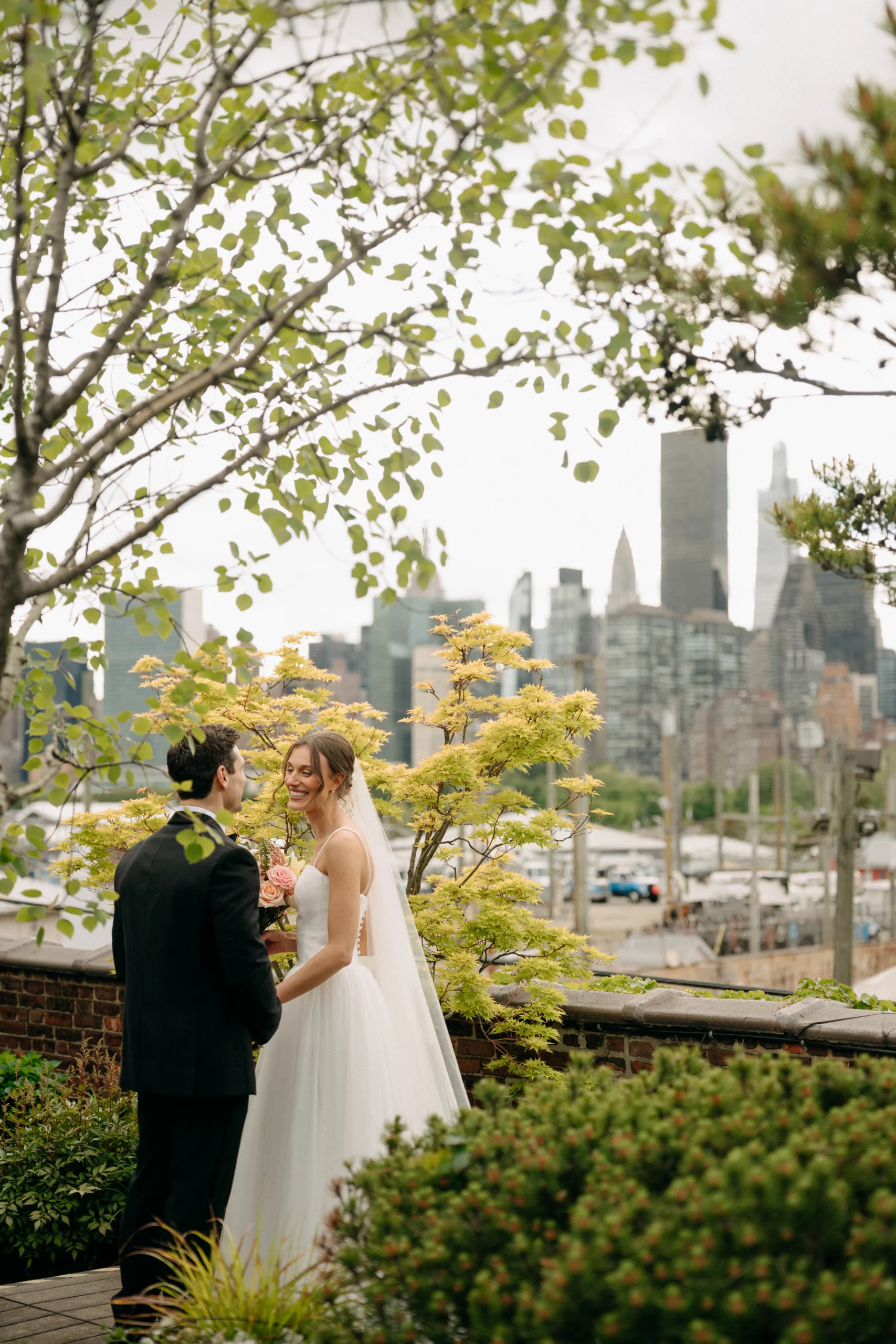 Couple portrait with New York skyline at The Foundry NYC.