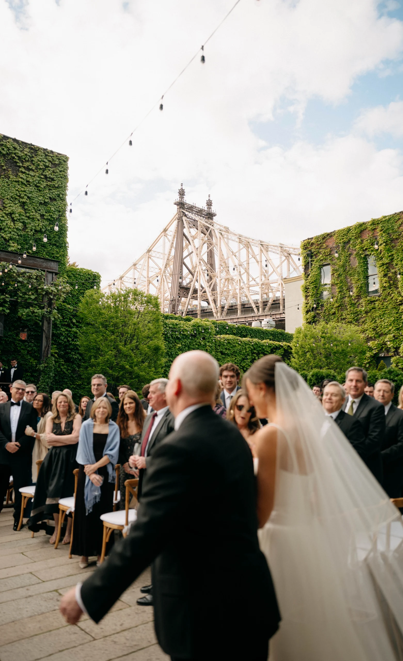 Catie walking into The Foundry NYC ceremony with father
