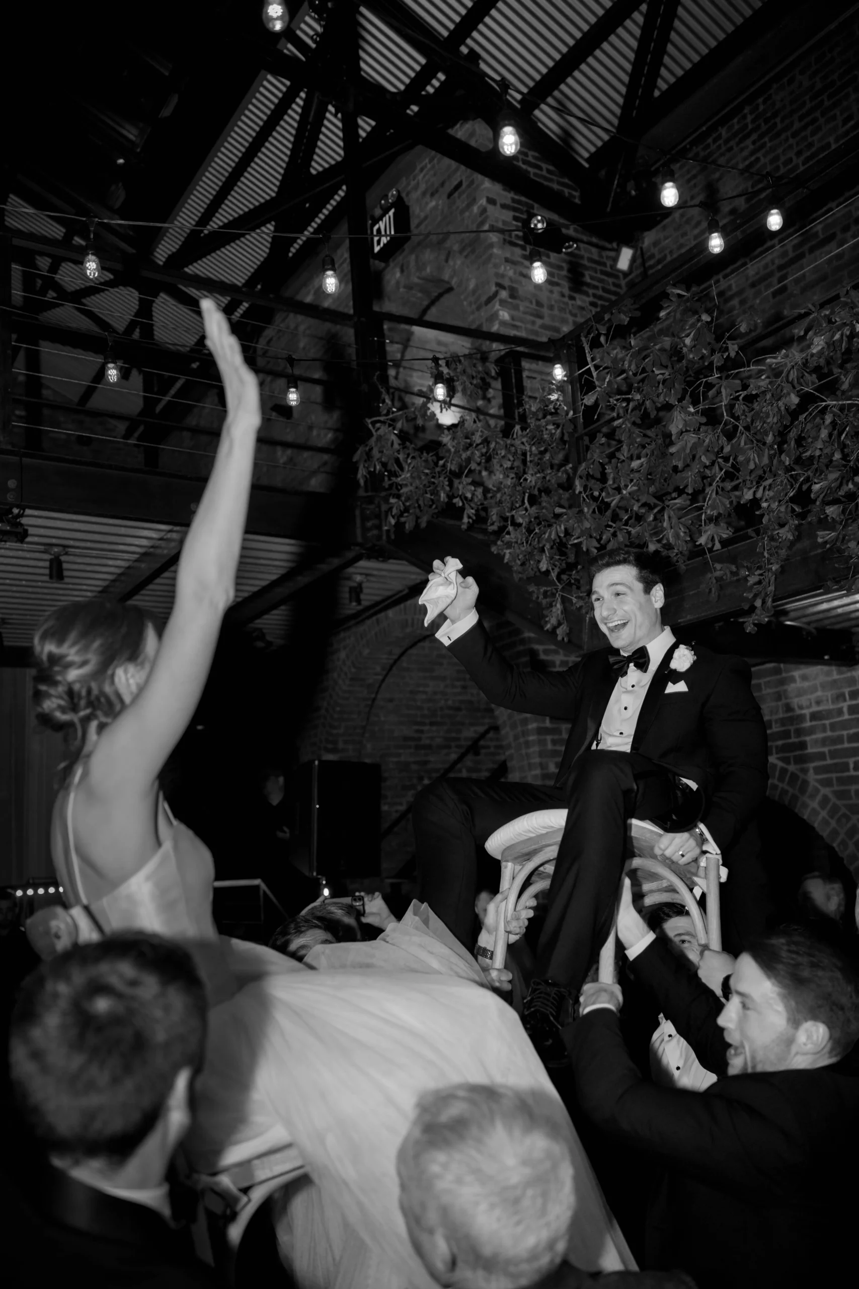 Bride and groom lifted during The Foundry NYC party
