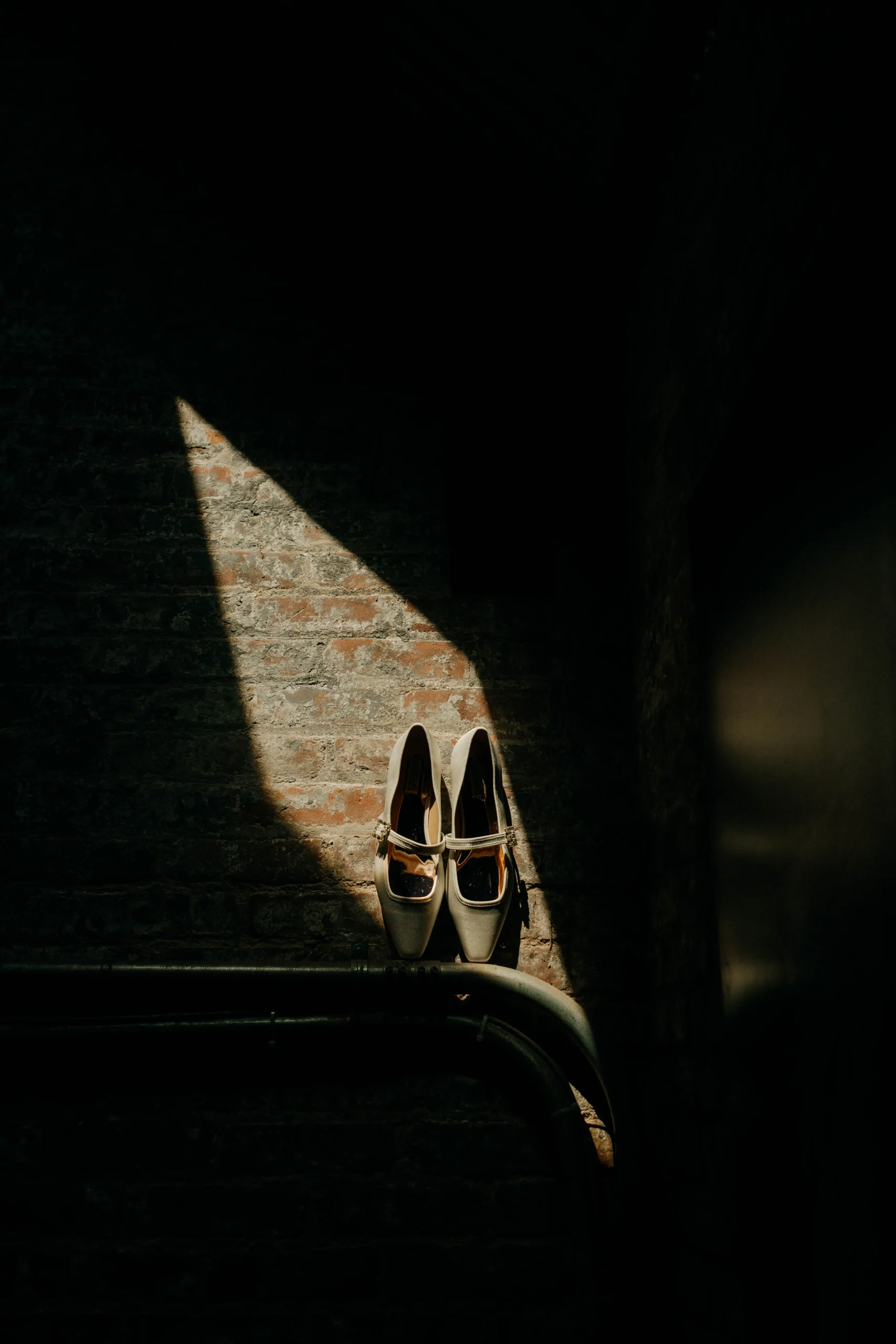 Bridal shoes in window light at The Foundry NYC wedding