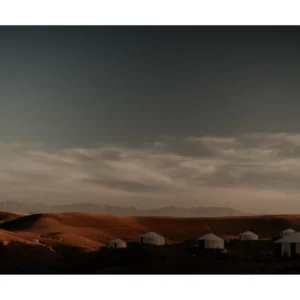 Marrakech desert fine art print of luxury tents under dramatic evening clouds