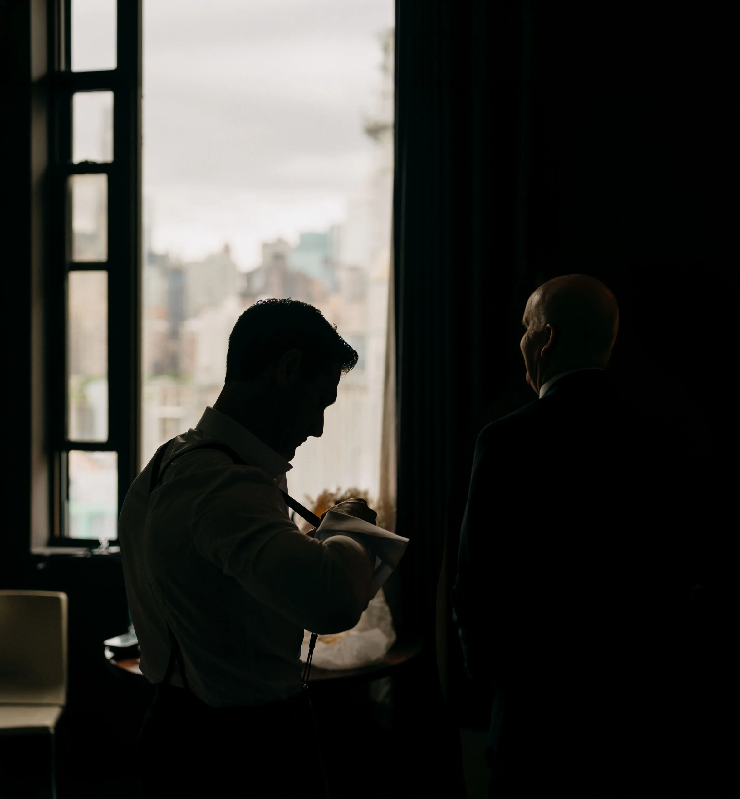 Groom getting ready at The Foundry NYC with New York view