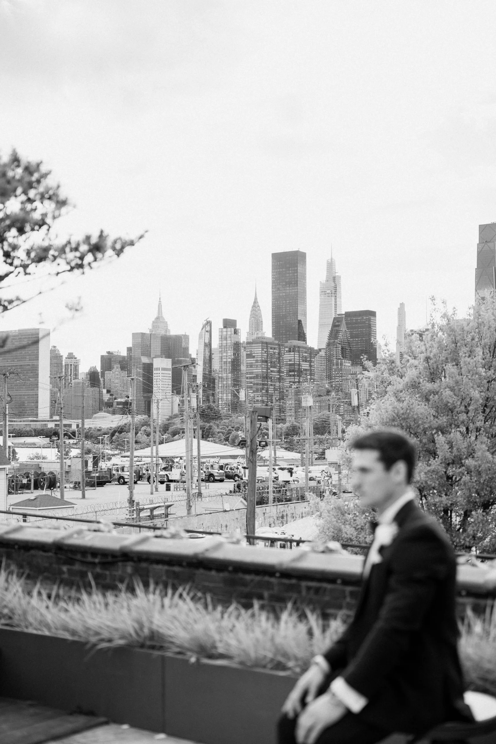 Groom portrait with New York skyline at The Foundry NYC