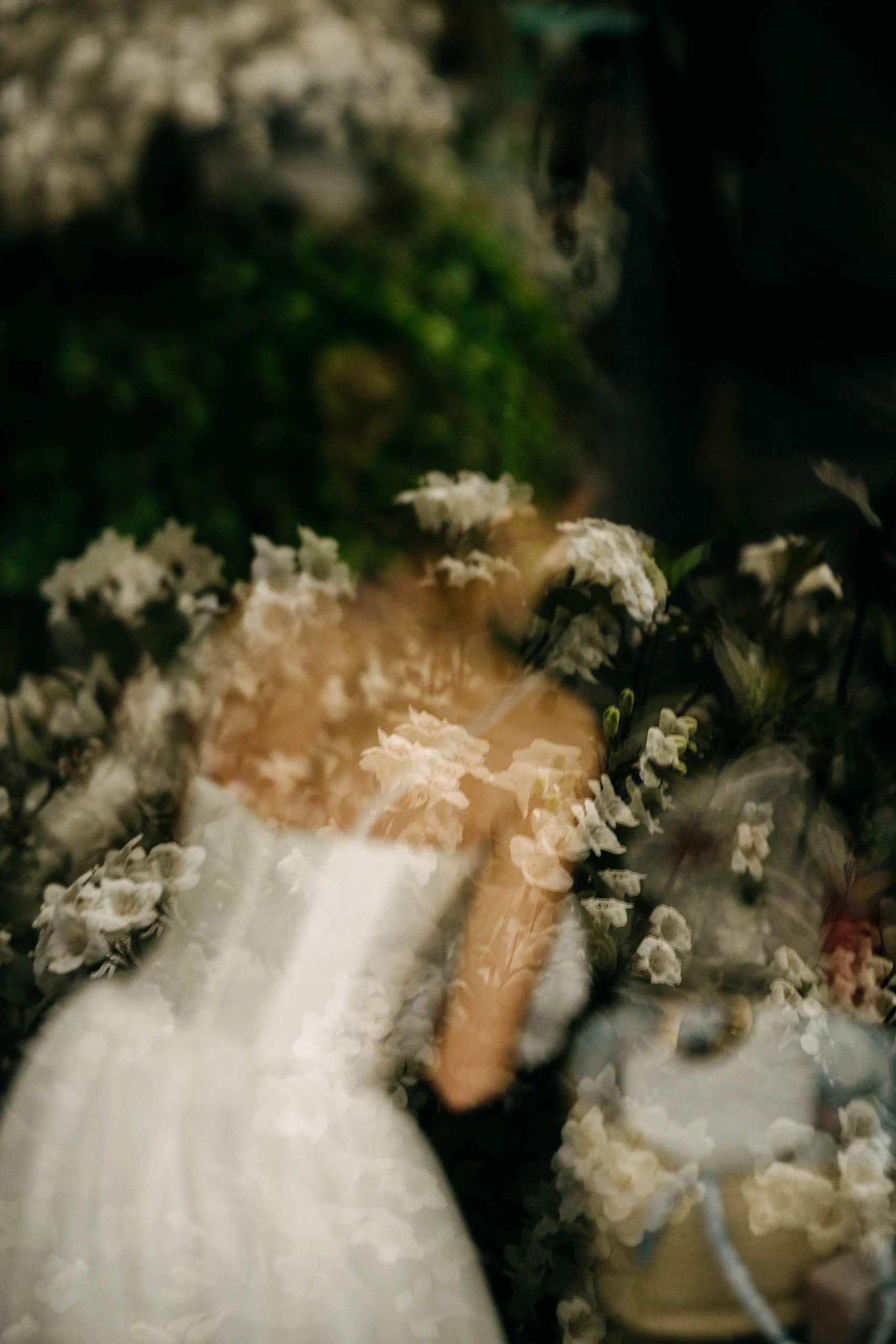 Bride reflected in flowers at The Foundry NYC wedding