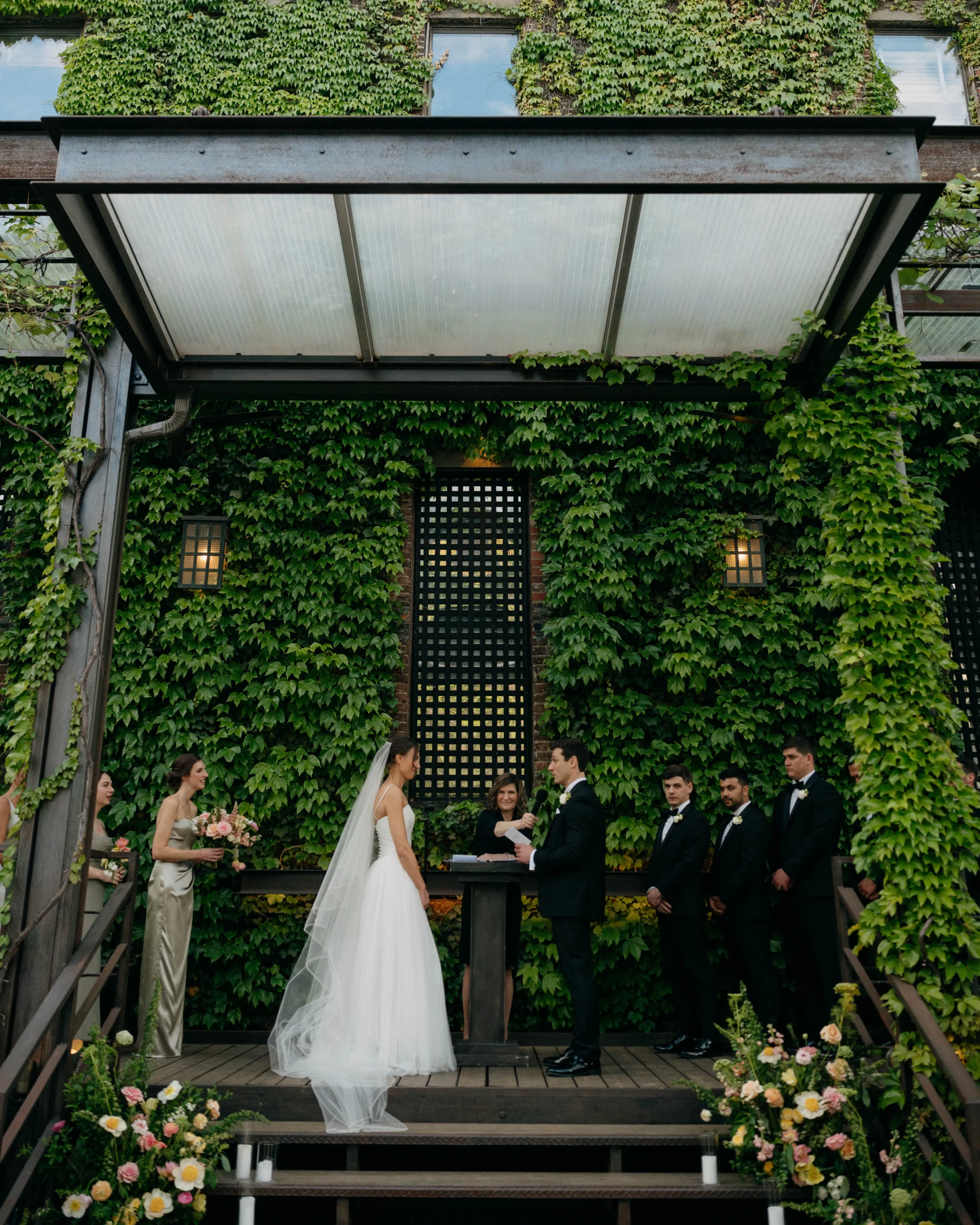 Catie and Ben exchanging vows at The Foundry NYC