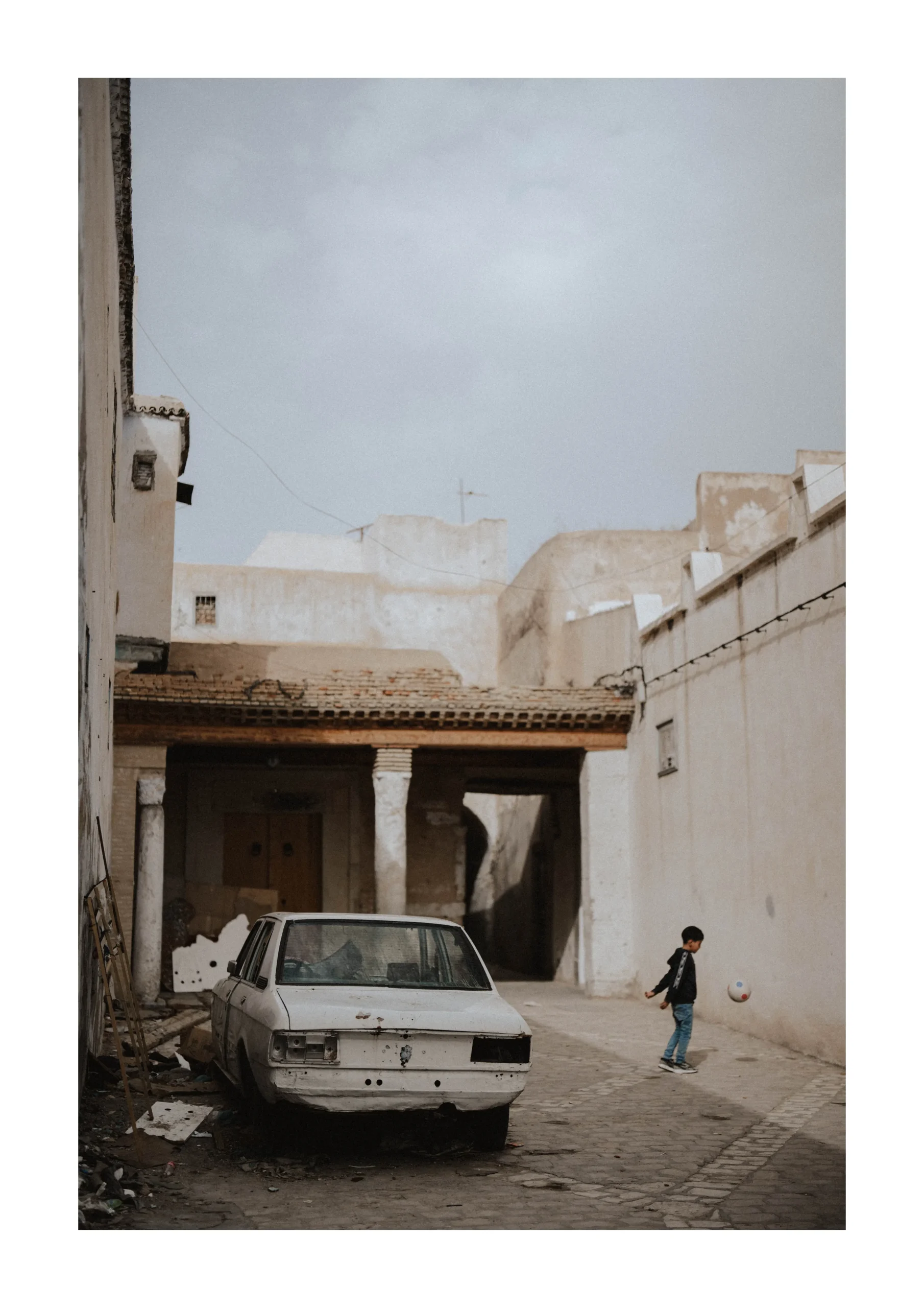 Tunis fine art print of a quiet street scene with an old car on 35mm Kodak 200 film